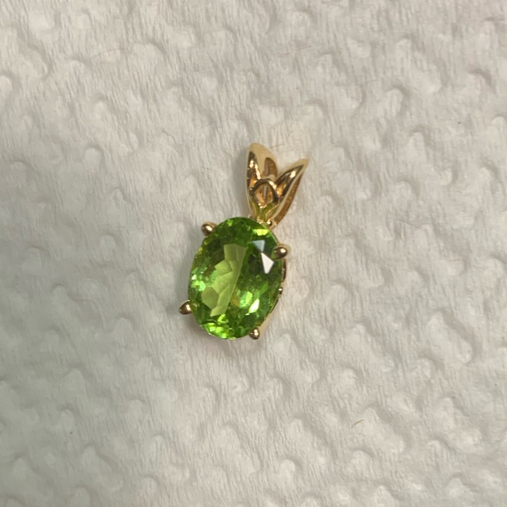 Green Oval Peridot Pendant in Gold Setting